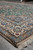 8 by 5 Nain rug edge view, ivory border and green field with crisp drawing