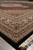 8x10 Oriental rug corner photographed low, showing camel guard bands and red palmettes