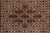 Extreme close-up of medallion core showing individual knots, silk sheen and diamond lattice
