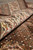 Rolled edge of the wool and silk rug showing ivory border pile depth and softness