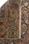 Reverse of the rug folded back, revealing the tight knot grid and original ivory fringe