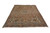 7'5 x 10'3 vintage Persian rug shown at an angle with soft salmon field and low pile