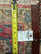 Back of the rug with measuring tape and hand woven tag showing tight wool knotting