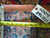 Back of the rug with tape measure, original fringe and tag reading 6004, 8.9 x 11.11