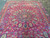 Upper half of the deep red field with cartouche pendant, vase motif and blue medallion