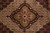 Macro of the black medallion core with rosettes, palmettes and multicolor floral detail
