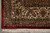 Corner detail of ivory main border with boteh paisley, leaves and knotted cotton fringe