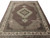 8x11 hand-knotted rug viewed from above with ivory spandrels, burgundy field and wide floral border
