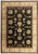 Black field hand-knotted wool and silk rug with ivory floral border and round rosette medallions