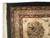 Corner detail with white cotton fringe, burgundy border stripe and dense hand-knotted wool pile