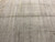 Wide field detail showing tonal gray stripes and a quiet column of tribal marks