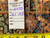 Back tag reading rug number 6493 and size 7.1 x 10.3 beside a measuring tape
