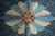Central 12 petal rosette medallion in turquoise, gold and ivory on deep teal ground