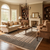Beige Bokhara rug anchoring a traditional living room with cream sofa, fireplace and wood bookcases