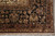 Corner detail with black border, salmon guard bands and ivory fringe on Indian hand-knotted rug