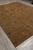 Corner perspective of the 9x12 rug showing sage leaves and crenellated stepped border line