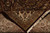 Folded corner showing ivory border front, softer reverse side, tight knotting and ivory fringe