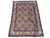 4'7" x 6'3" Persian Feraghan rug photographed at an angle showing full ivory field and blue borders