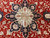 Close macro of the central star medallion in ivory and navy with rose palmettes