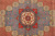 Close-up of the central octagonal star medallion with 8 petal rosette and navy ray banding