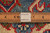 Macro shot of wool pile beside a ruler with authentic handmade label showing knot density