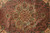 Detail of 8 petal sage green rosette core surrounded by rust vinework and boteh