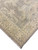 Corner detail of the neutral Oushak runner showing gold vine border and hand-knotted wool texture