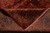 Back of the hand-knotted Kashan rug folded to reveal tight cotton foundation and knots