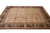 9 by 12 Indian Oriental rug laid flat, ivory ground with rust vines and black border
