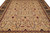 Close overhead of the ivory field with rust diamonds, green leaves and Zigler floral repeat