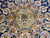 Center medallion detail in sage, gold and ivory with 8 petal rosette and navy accents