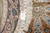 Workshop tag reading rug number 59500, size 5' x 5', next to silk fringe