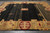 12' x 14'6" hand-knotted Indian Gabbeh rug photographed flat showing charcoal field and gold Deco border