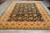 Large 9x13 room size Oriental rug showing ivory border, black field and ivory cotton fringe