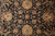 Detail of the all-over floral field in black, gold, sage green and coral tones