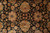 Macro of black ground floral lattice with coral, sage and gold palmettes and leaves