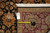 Back tag and tape measure confirming the hand-knotted Indian rug size and knot density