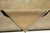 Folded corner revealing tight cotton foundation and low even wool pile on the reverse side