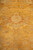 Golden field showing a rosette on curving vine stems, hand-knotted in fine natural wool