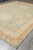 9' x 11'9" Chotan Chobi rug from the corner with camel border and ivory fringe