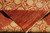 Folded corner exposing solid coral back, ivory cotton fringe and dense hand knotted wool pile