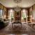 Traditional living room with green sofa, chandelier and large burgundy hand-knotted wool rug underfoot