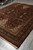 Diagonal showroom shot of the large 9x12 burgundy and black traditional wool area rug