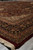 Angled floor view of 8'10" x 11'9" rug showing border depth and ivory spandrel detail