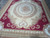8x10 flat weave Aubusson rug corner showing heart shaped palmette and wide camel outer border