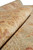 Macro shot of low wool pile and hand-spun yarn texture along the rolled runner edge