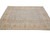 Angled view of 8'2" x 9'7" hand-knotted wool rug showing ivory border and blue field