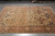 8x12 Agra rug from India showing antique-style all-over floral field, angled view