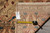 Rug back with authenticity tag and tape measure confirming the 8'2" x 12'1" size