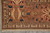Corner detail of coral border with boteh guard stripes and ivory fringe ends